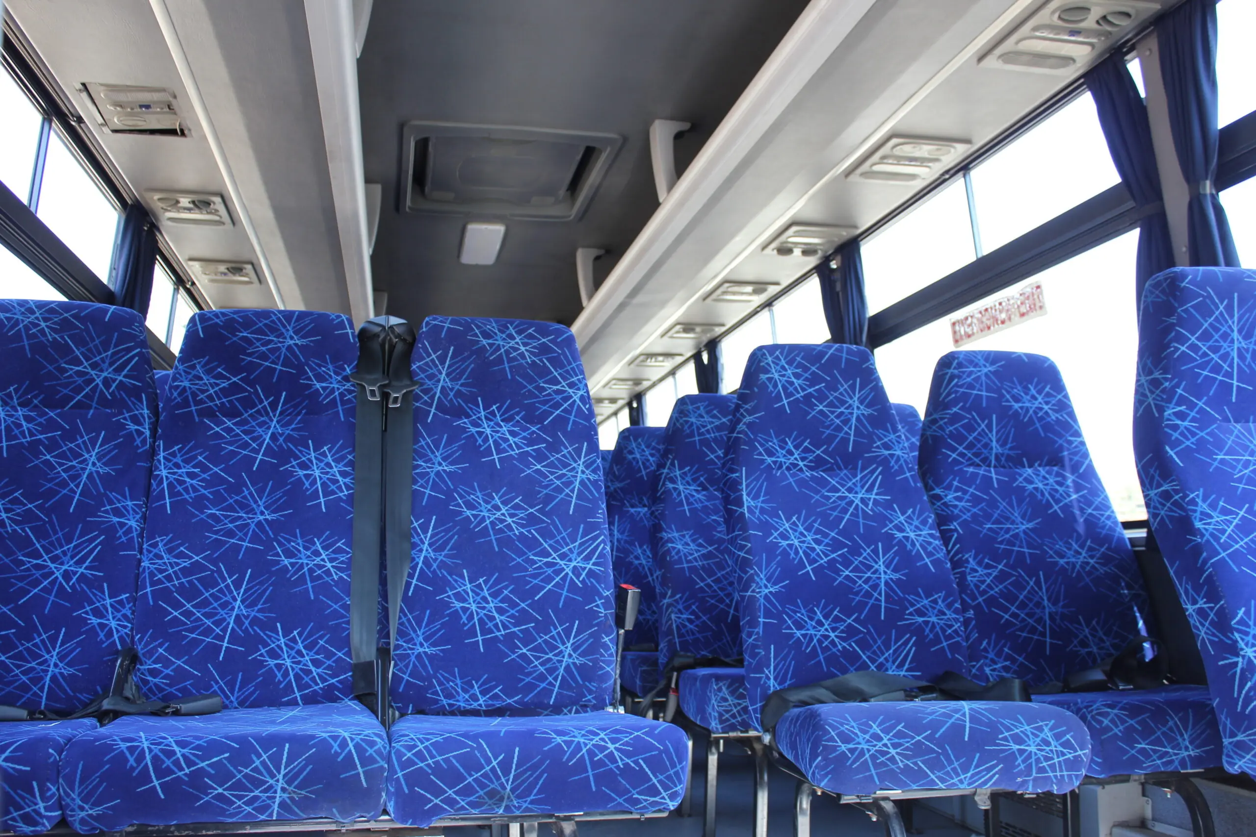 60-Seater Yutong F11 bus with cloth seats, 2-point safety belts and underfloor luggage compartments for hire in Gauteng. Ideal for school trips, sports days, private charters, corporate events, and more.